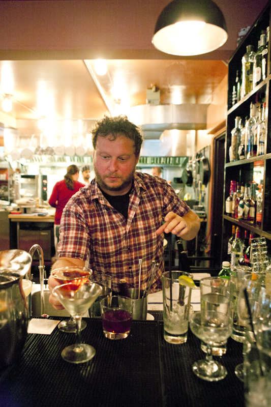Bartender Craig making drinks during a dinner rush.