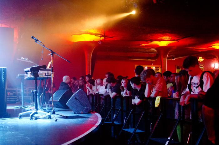 Fans wait patiently for almost an hour for the opening act to begin.