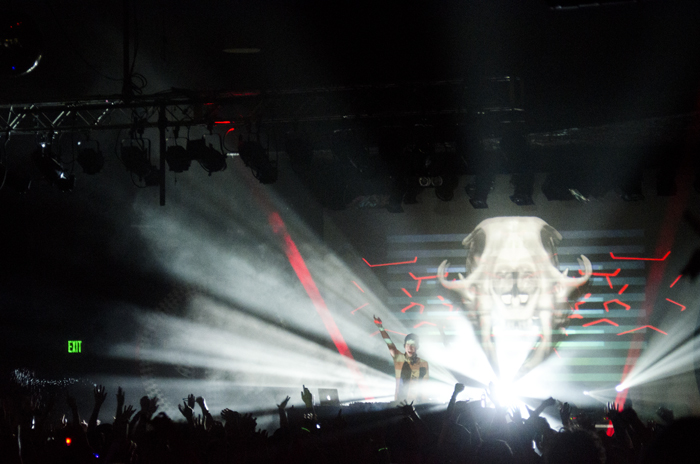 Porter Robinson performing with one of his many projections.