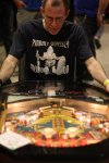 Andre Needham from Redmond plays a sit-down pinball machine, which he said was particularly fun because the slant of the table makes game play slower.