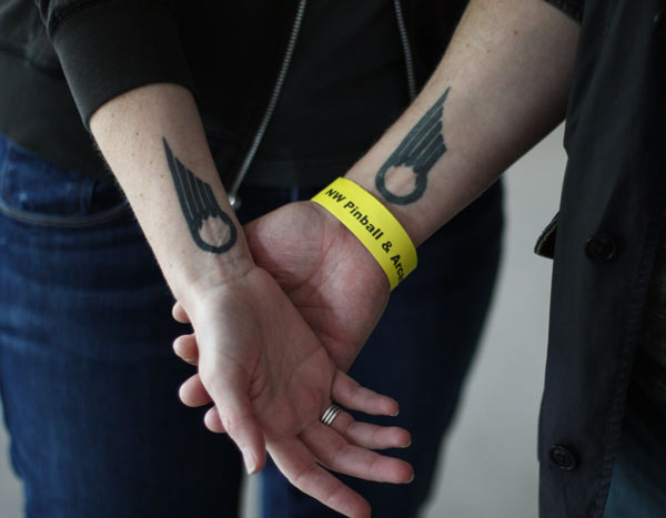 Mary Rourke and Wyeth Johnson got matching Bally pinball tattoos for their first wedding anniversary.