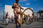 One part critical mass and one part nudist expression, the World Naked