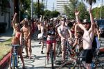 One part critical mass and one part nudist expression, the World Naked