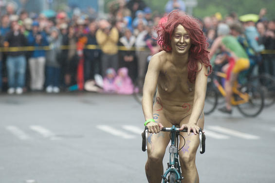 One part critical mass and one part nudist expression, the World Naked