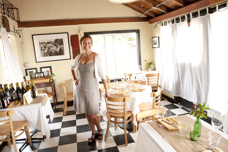 Kristin Page finishes getting the dining room ready for service.