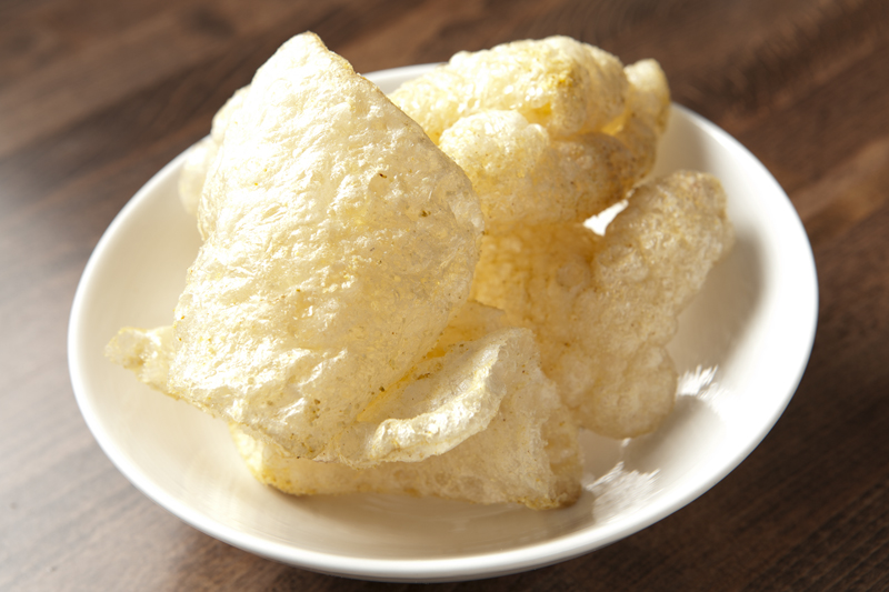 Cardboardy pork rinds looked and tasted like puffed paperweights.