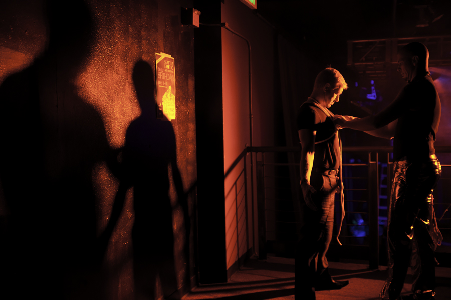 A man has decorative bondage done to him upstairs at the event. Artists from Suspended Animation were decoratively binding attendees.