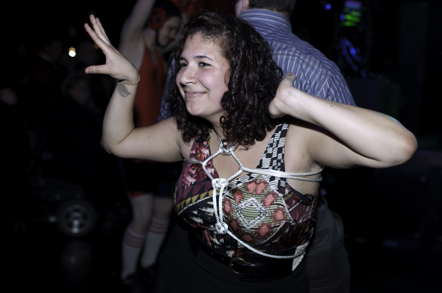 An audience member busts a move with her newly created decorative bondage ropes.