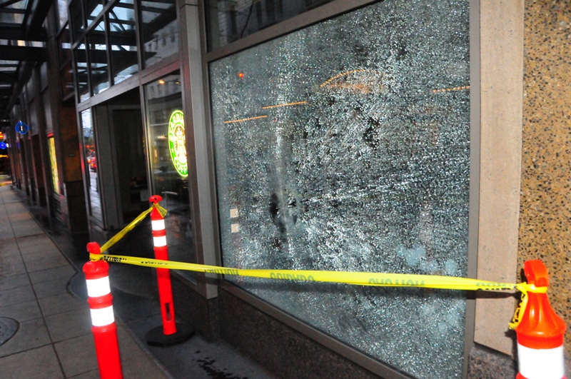 A broken Starbucks window on 6th Avenue.