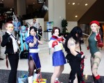 An arrangement of characters from Street Fighter, Sailor Moon, andFinal Fantasy take a second to pose before entering Sakura-Con.