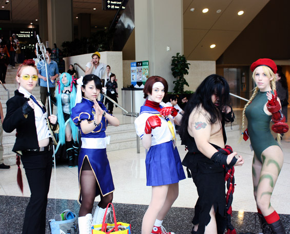 An arrangement of characters from Street Fighter, Sailor Moon, andFinal Fantasy take a second to pose before entering Sakura-Con.