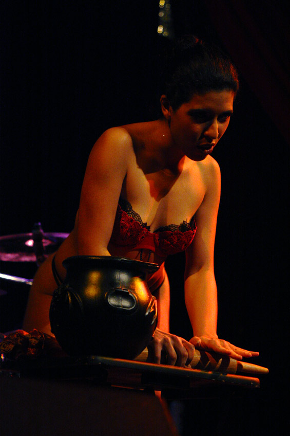Boom Boom L'roux starts off her performance dressed as a witch adding body parts to her cauldron.