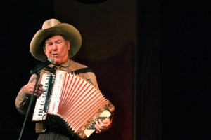 The yodeling cowboy, Sourdough Slim aka Rick Crowder, plays the accordion while his fast paced yodeling entices the crowd.