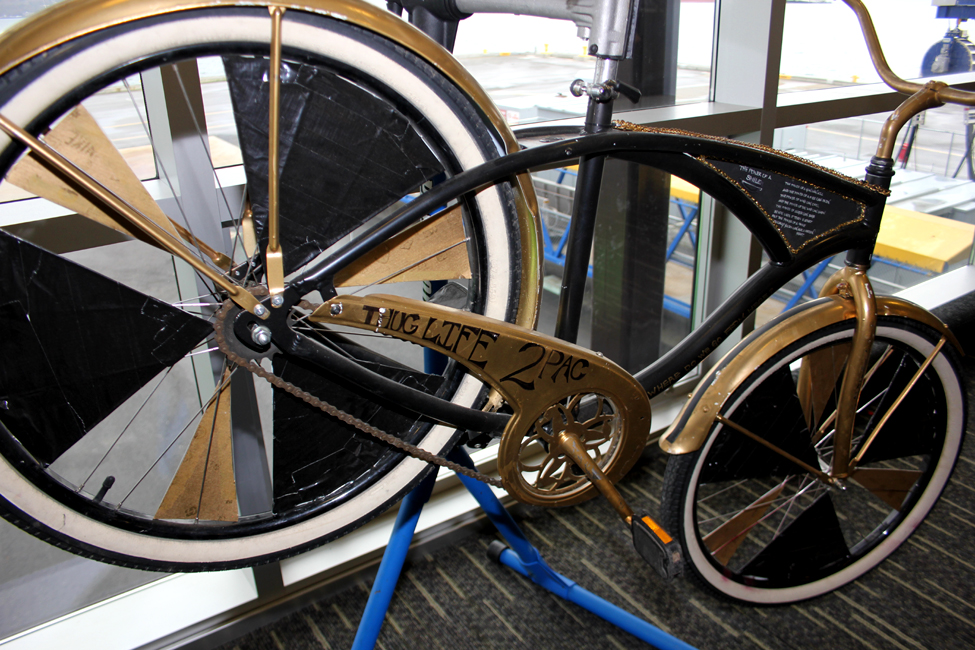 Tupac Scraper by Kat Sweet. The goal of this project is to start a scraper bike program with  low-income housing kids in Magnuson Park. Outcome: 27 kids have come through the ear-a-scraper program, having learned about fixing, creating, and riding bikes.