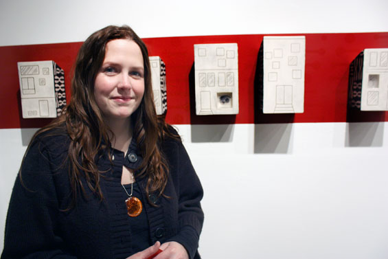 Sarah Haven poses with one of her favorite ceramic works.