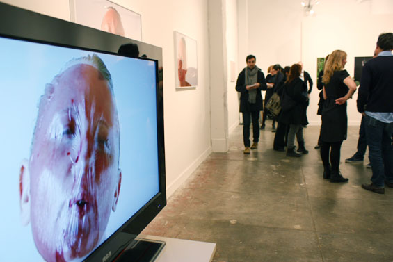 A video installation of Russell inhaling and exhaling into a mask.