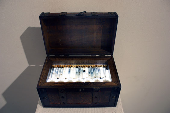 Abjection Collection by Dominic Sansone, which proudly displays vials of beard juice and containers of finger and toenail clippings in a LED lit box.
