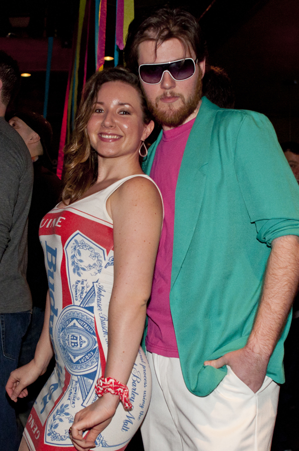 Her outfit was a hit, and perhaps more successful than his. Points for effort on the bright colors, man!