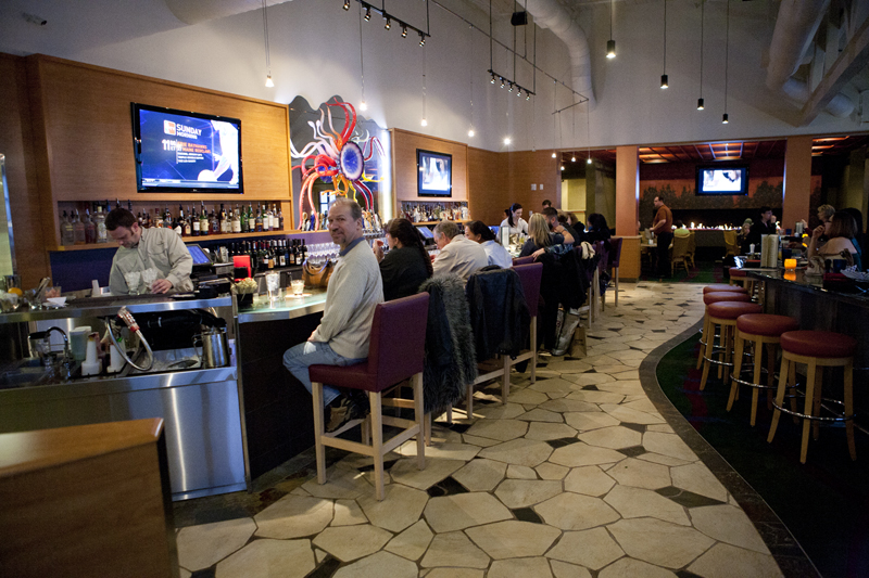 The bar is packed during happy hour.