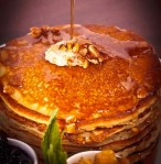 Carb load with buttermilk pancakes, mixed berry compote, and banana walnut and cinnamon apple sauces from City Hall, Miami, Florida.
