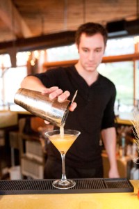 Bartender Kevin Davis pouring the Honeymoon Cocktail.