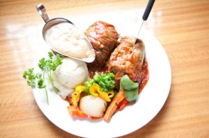 Sweet, tomato-drenched cabbage rolls, bloated with ground beef,were excellent.