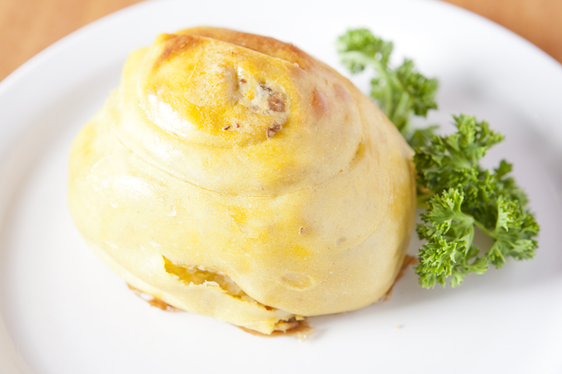 The dumpling was crisscrossed by too much dough, and baked until it was dry as a desert riverbed.