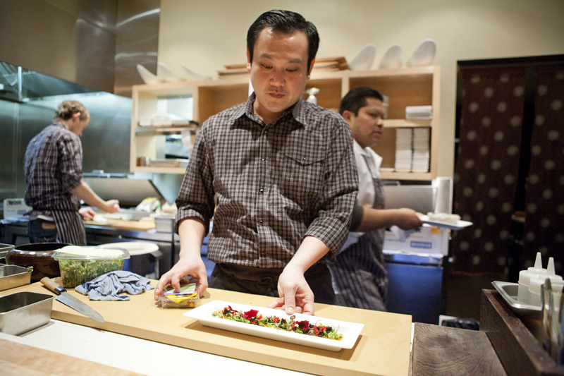 Executive Chef Chris Vilayphanh gives the Salmon Usuzukuri one final look over.
