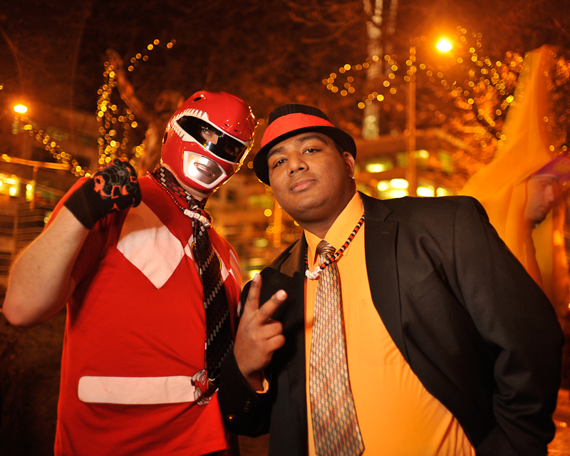 Clad in business attire and wielding boomboxes, hundreds of revelers romped around