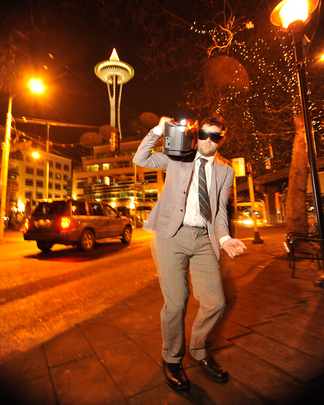 Clad in business attire and wielding boomboxes, hundreds of revelers romped around