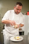Owner and Chef Sam Crannell shaving foicgras torchon onto the vealbreast dish.