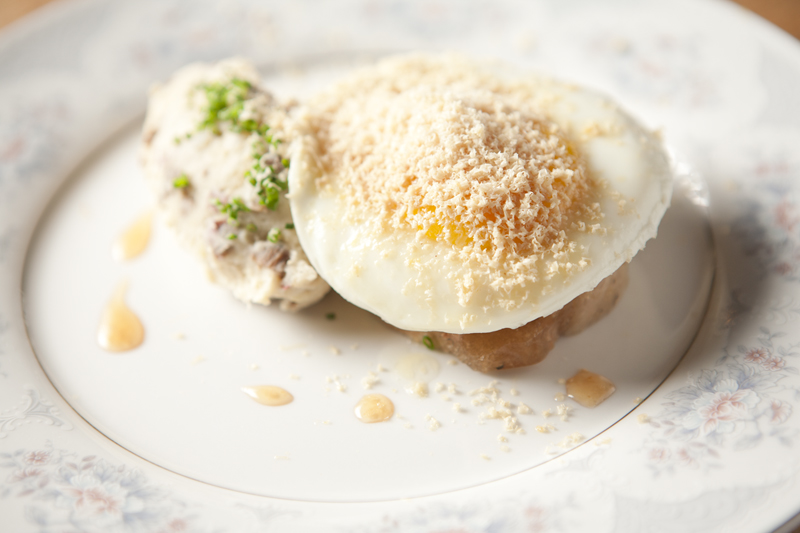 Veal breast, porcinis-potato mash, apple, torchon, topped with a fried egg.