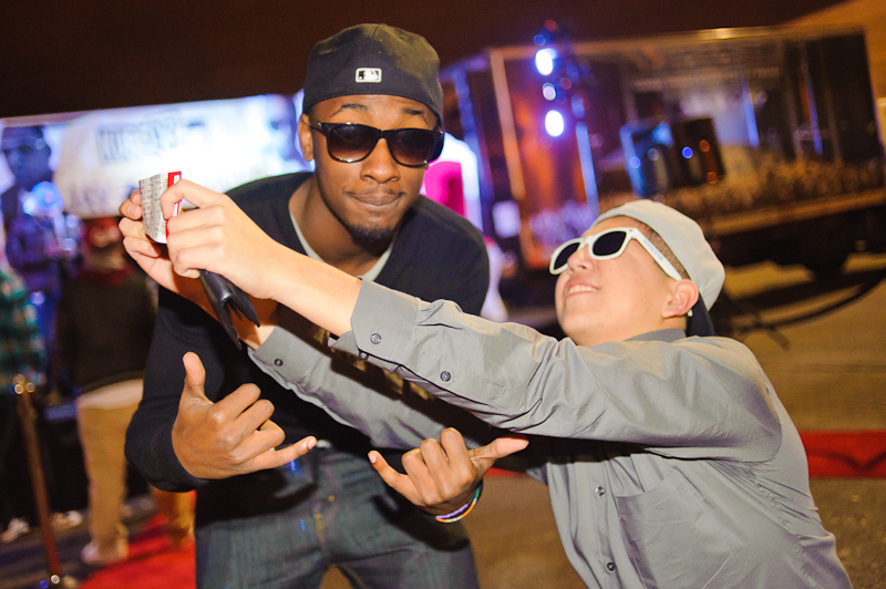 Excited winners of Kube 93.3 FM's rapping contest showing off the Throne tickets they just won.