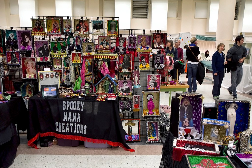 Alicia Sigala of Spooky Mama Creations is inspired bycolorful and elaborate Day of The Dead Mexican folk art altars, and adds a pop culturewink. She picked the VIVA LOTERIA altar as most representative of her work.(www.mourningmarket.com)