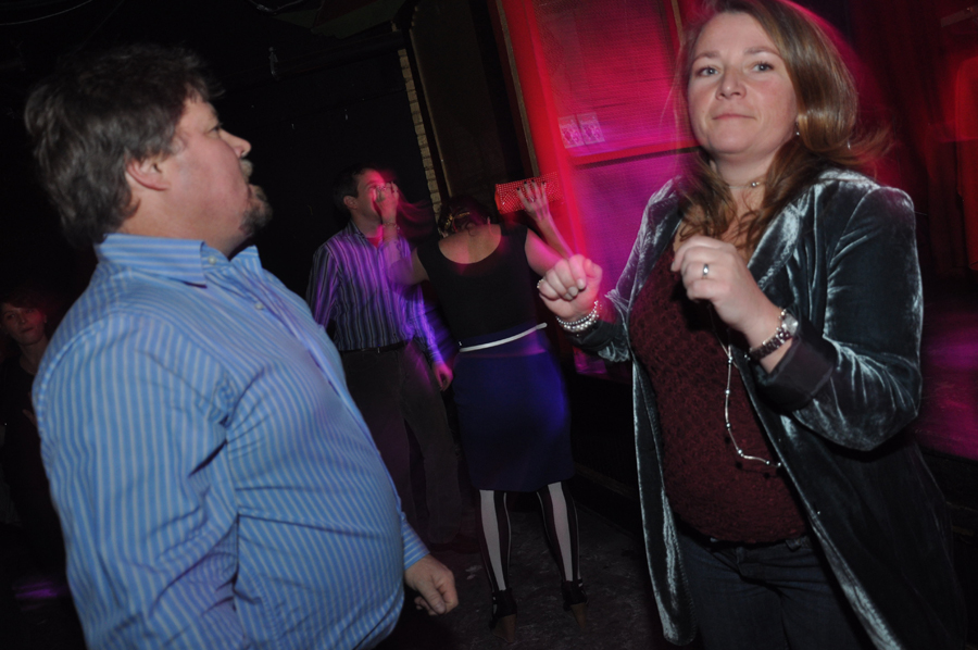 Check out her velvet jacket, and those stripey tights in the background!