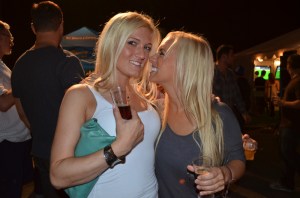 Alicia Strand and Krystel Miller use their tokens to get some microbrewed beverages.