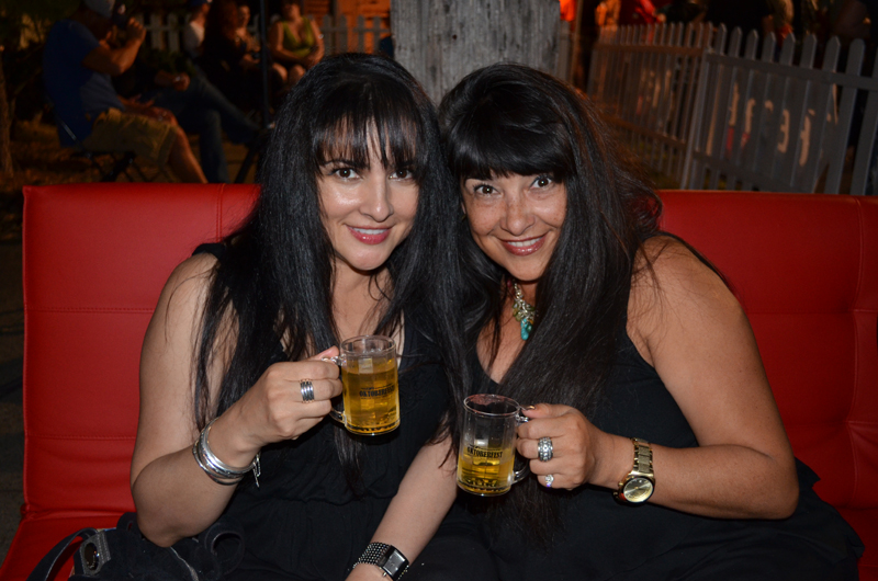Sisters Diana and Linda Tiliano sip on their complimentary tasting mugs.