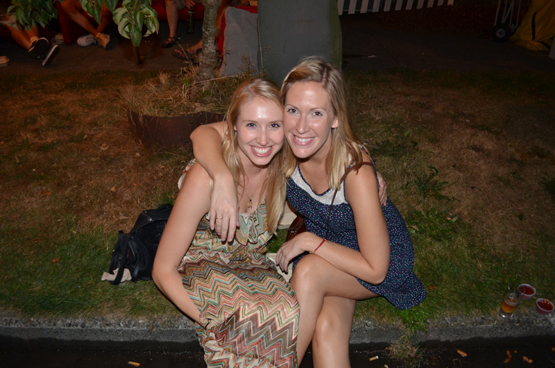 Oktoberfest cuties Lisa Perazzoli and Lauren Nelson take a break from the madness on the curb.