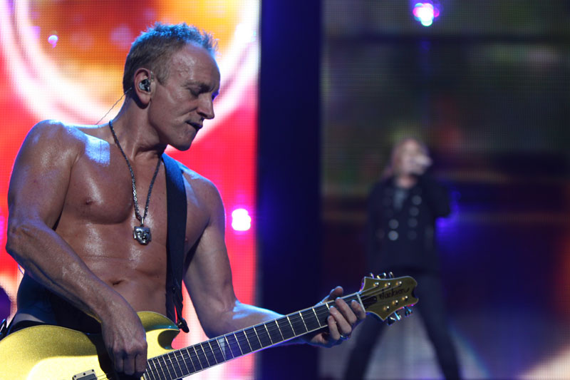 Phil Collen of Def Leppard goes shirtless.