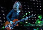 Nancy Wilson of Heart plays guitar dressed like a Catholic school girl.