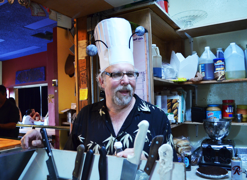 Host of the night David Gordon dons his special chef hat.