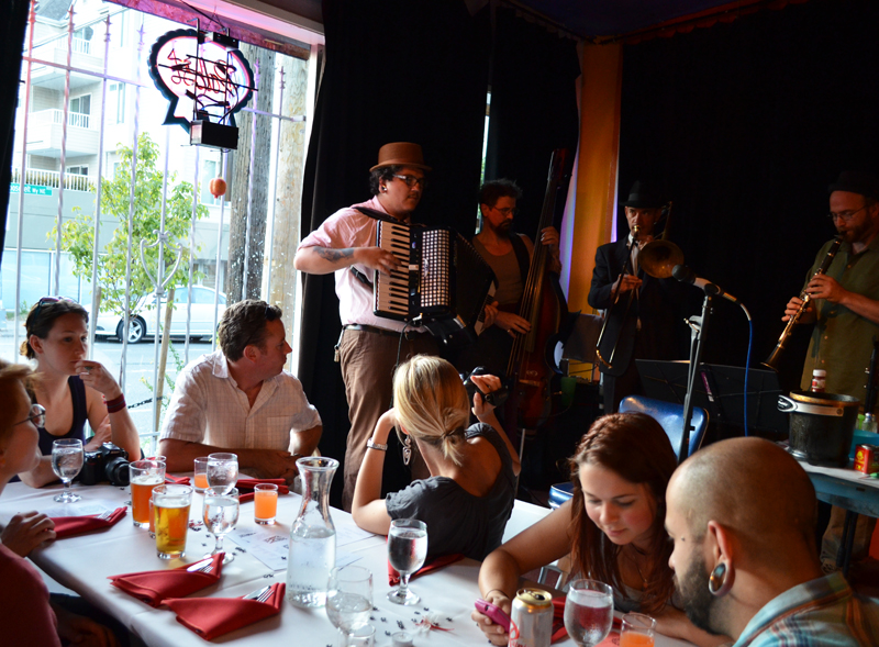 The crowd enjoys the band GodaE™s Favorite Beefcake.