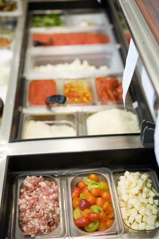 Delicious pizza toppings and salad makings.
