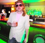 Dan Sherren, awesomely grody in mullett hair and aviator glasses.