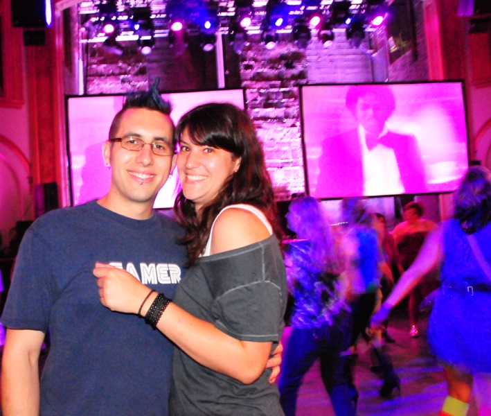 Austin McGee in a blue mohawk and Ashley Kolberg.