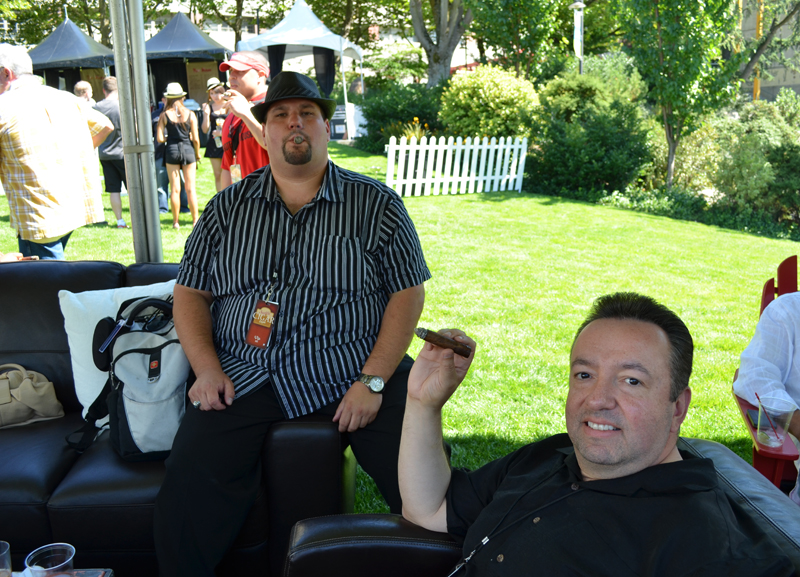 Brian Groves, President of a Limo company, and Herman Fierro leisurely puff away.
