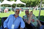 Scott Bruce Duncan and Bill Paley, a cigar maker, relax in the shade.
