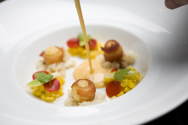 Our servers were especially proud of a thick corn bisque with clumps of Dungeness crab. The soup bobs with sweet piquillo peppers and, in what amounts to a seafood-hater's rumaki, nuggets of white fingerling potatoes wrapped in bacon.