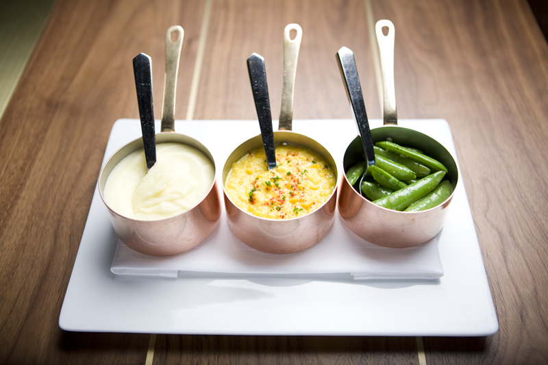 ... ramekins of corn and mashed potatoes so creamy they might have been milked straight from a cow's teat.