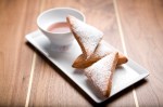Much-touted beignets, paired with a supremely alcoholic butterscotch sauce layered with caramel, are dense and bland.